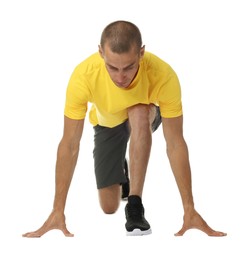 Photo of Runner in starting position on white background