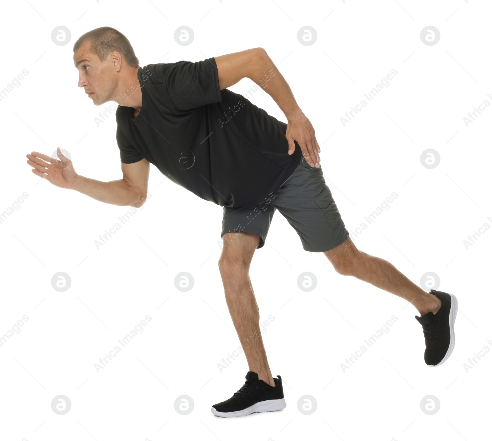 Man in sportswear running on white background Photo of Man in sportswear running on white background