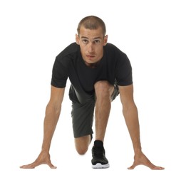 Photo of Runner in starting position on white background