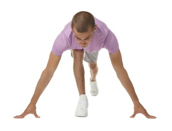 Photo of Runner in starting position on white background