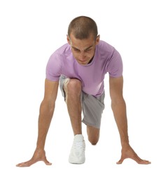 Photo of Runner in starting position on white background