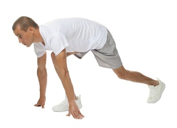 Photo of Runner in starting position on white background