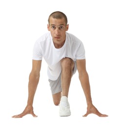 Photo of Runner in starting position on white background