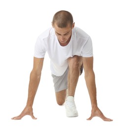Photo of Runner in starting position on white background