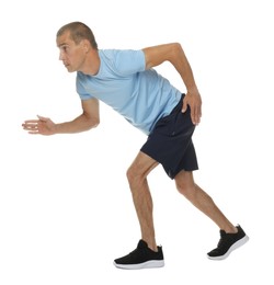 Photo of Man in sportswear running on white background