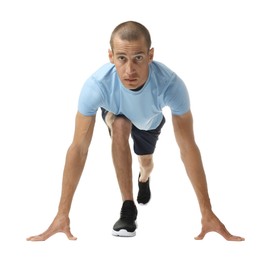 Photo of Runner in starting position on white background