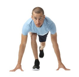 Photo of Runner in starting position on white background