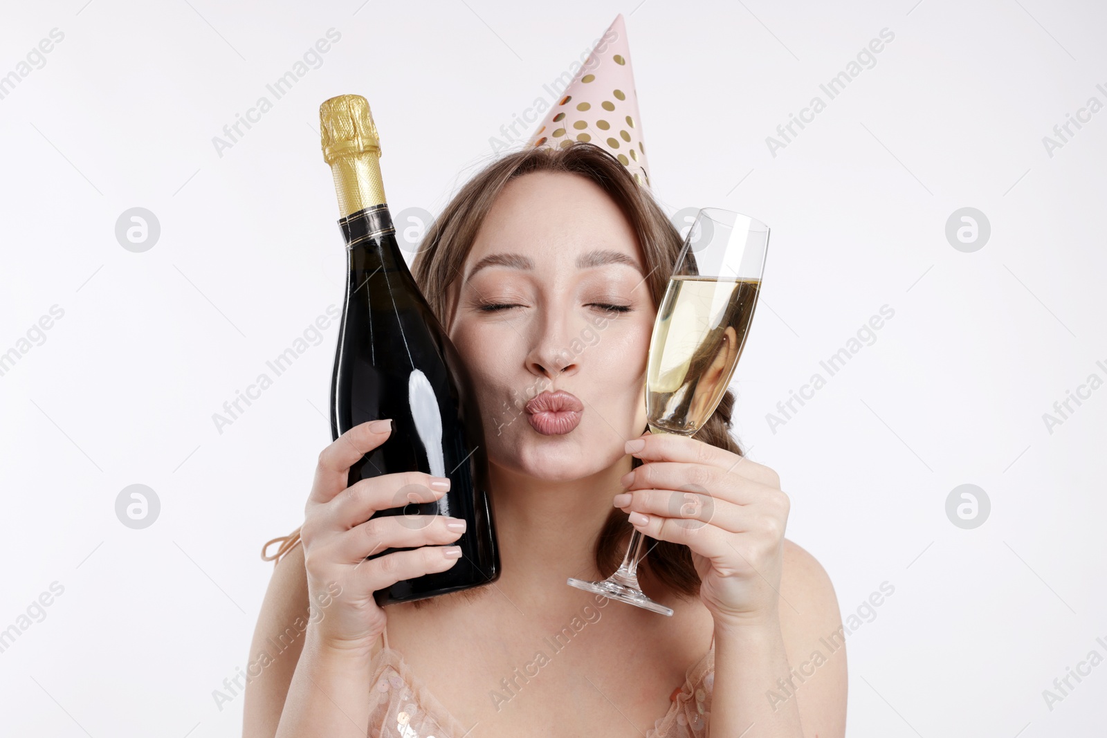 Birthday celebration. Woman with sparkling wine on white background Photo of Birthday celebration. Woman with sparkling wine on white background
