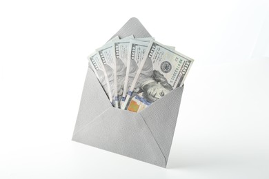 Photo of Money bonus. Envelope with dollar banknotes isolated on white