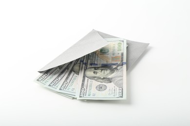 Photo of Money bonus. Envelope with dollar banknotes isolated on white
