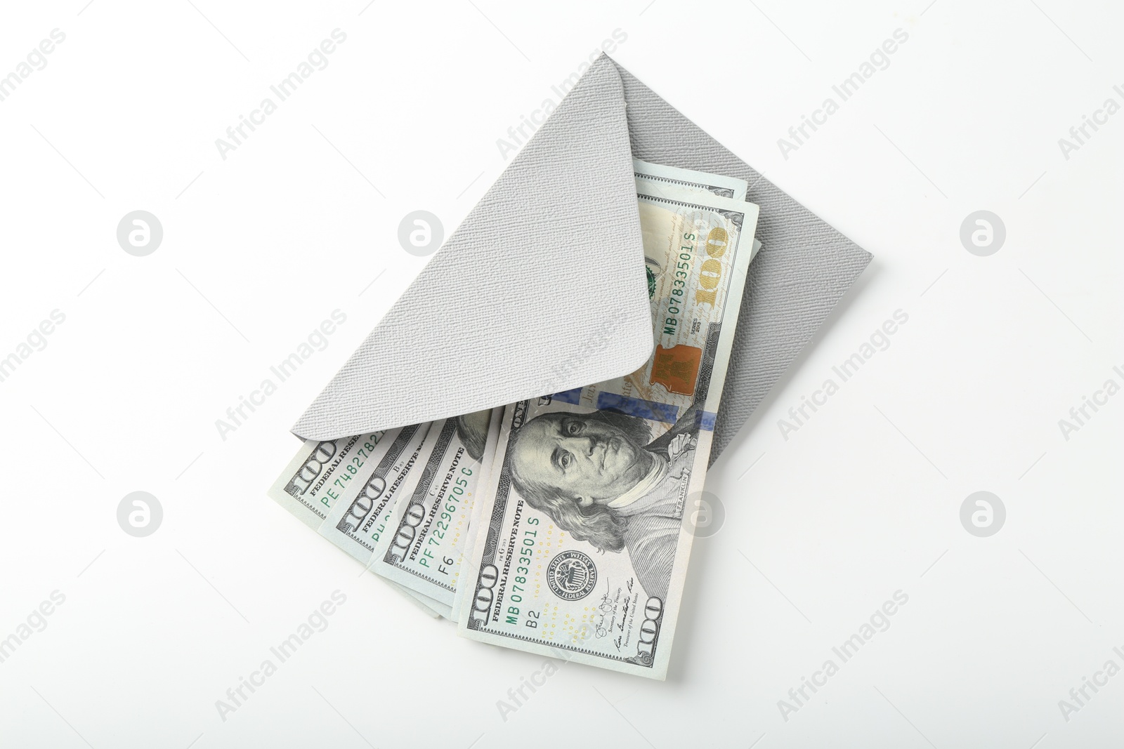 Money bonus. Envelope with dollar banknotes isolated on white, top view Photo of Money bonus. Envelope with dollar banknotes isolated on white, top view