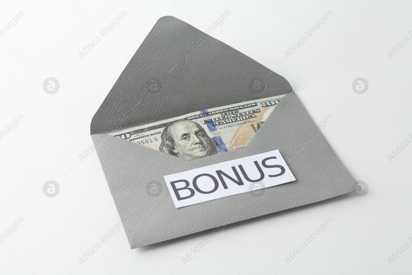 Envelope with word Bonus and dollar banknotes isolated on white Photo of Envelope with word Bonus and dollar banknotes isolated on white
