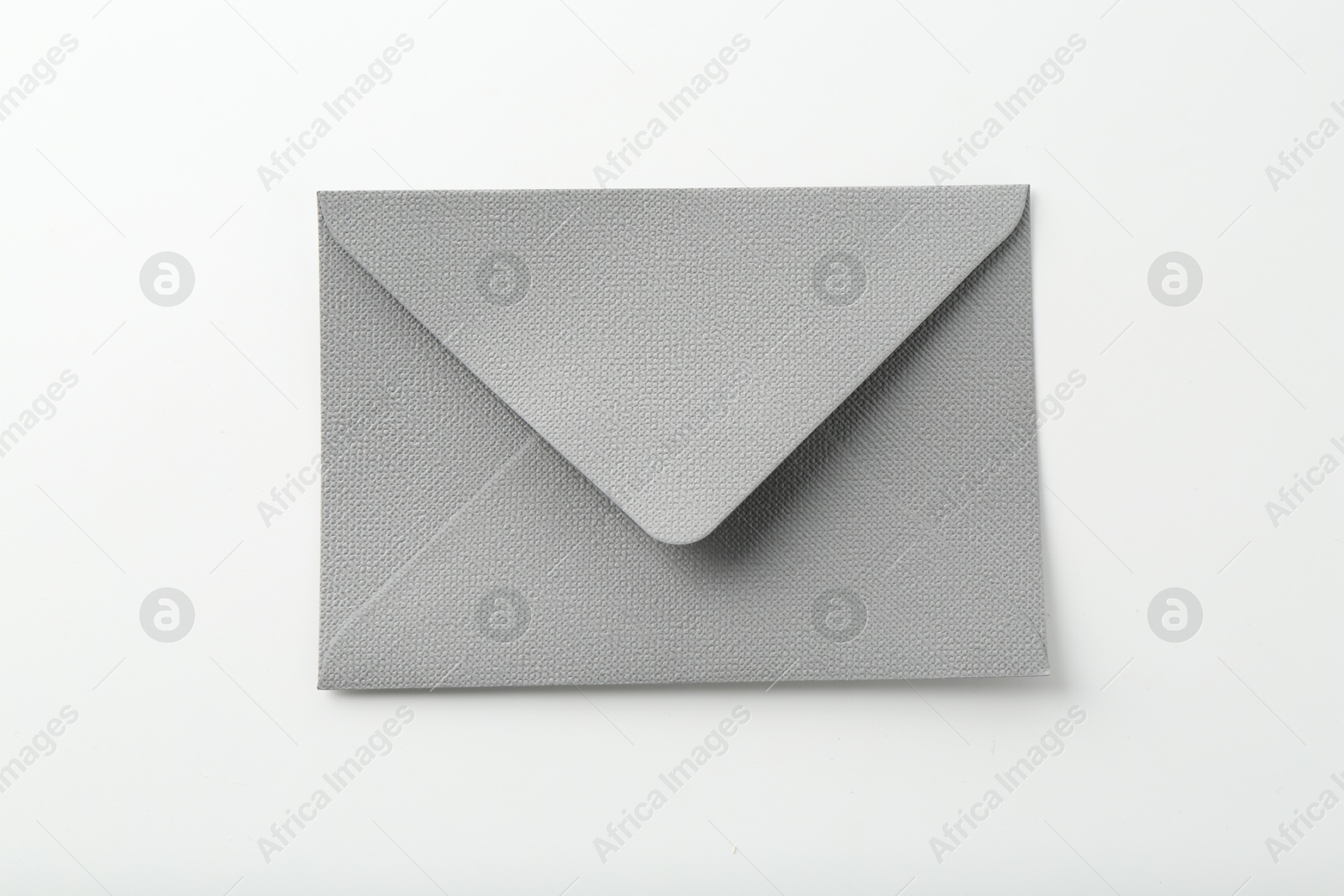 One closed grey envelope isolated on white, top view Photo of One closed grey envelope isolated on white, top view