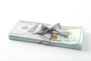 Photo of Money bonus. Dollar banknotes with bow isolated on white