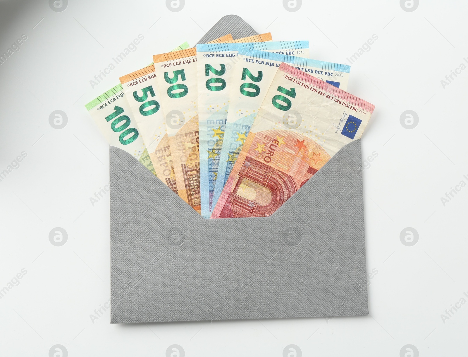 Money bonus. Envelope with euro banknotes isolated on white, top view Photo of Money bonus. Envelope with euro banknotes isolated on white, top view