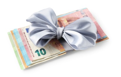 Photo of Money bonus. Euro banknotes with bow isolated on white