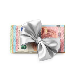 Photo of Money bonus. Euro banknotes with bow isolated on white, top view
