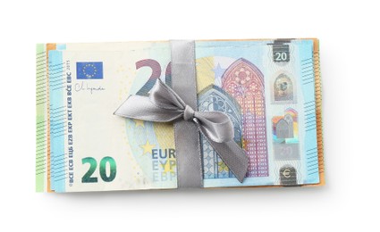 Photo of Money bonus. Euro banknotes with bow isolated on white, top view