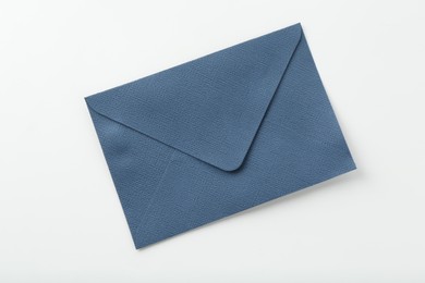 Photo of One closed blue envelope isolated on white, top view