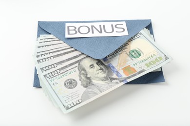 Photo of Envelope with word Bonus and dollar banknotes isolated on white