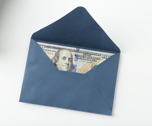 Photo of Money bonus. Envelope with dollar banknotes isolated on white, top view