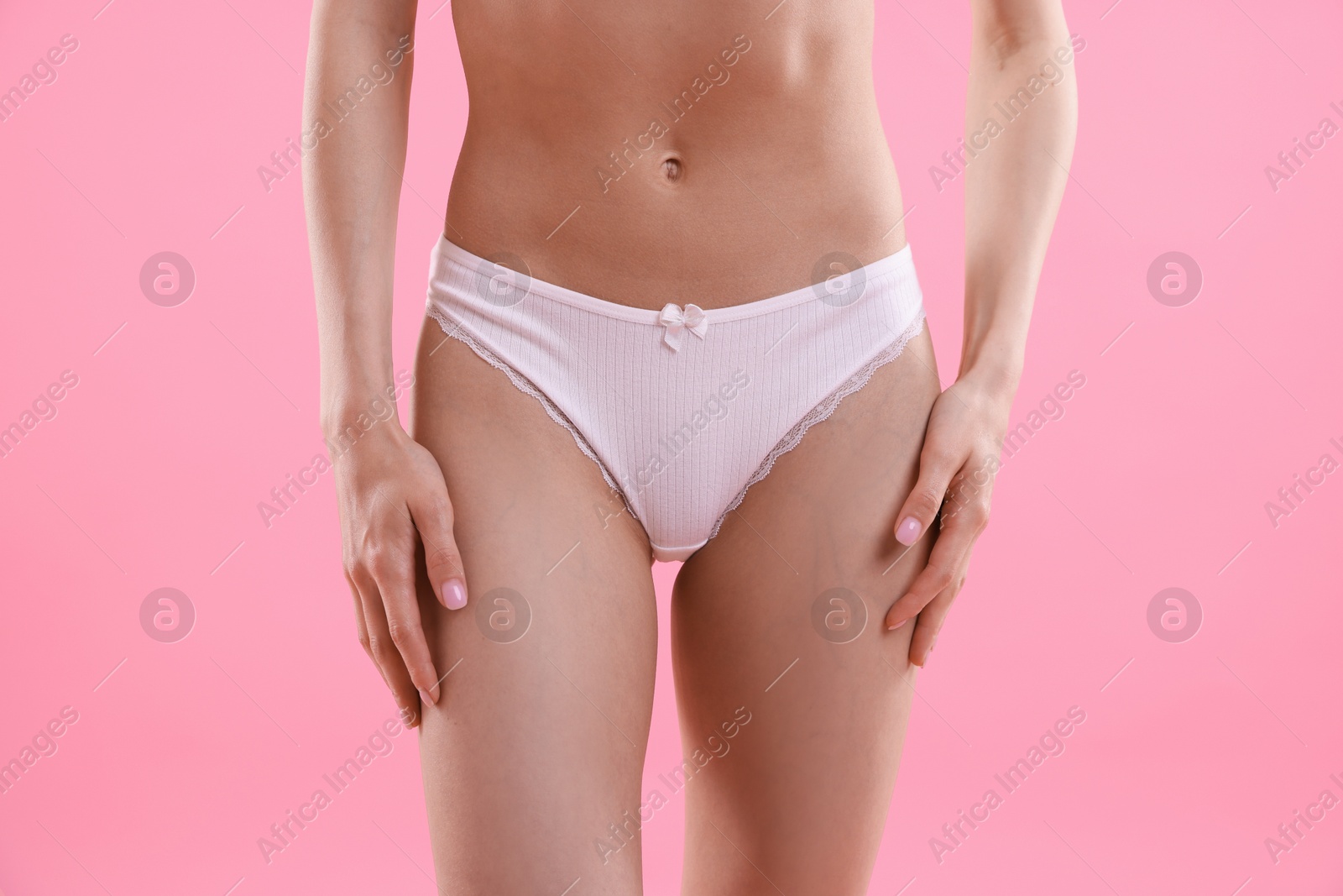 Woman wearing beautiful underwear on pink background, closeup Photo of Woman wearing beautiful underwear on pink background, closeup