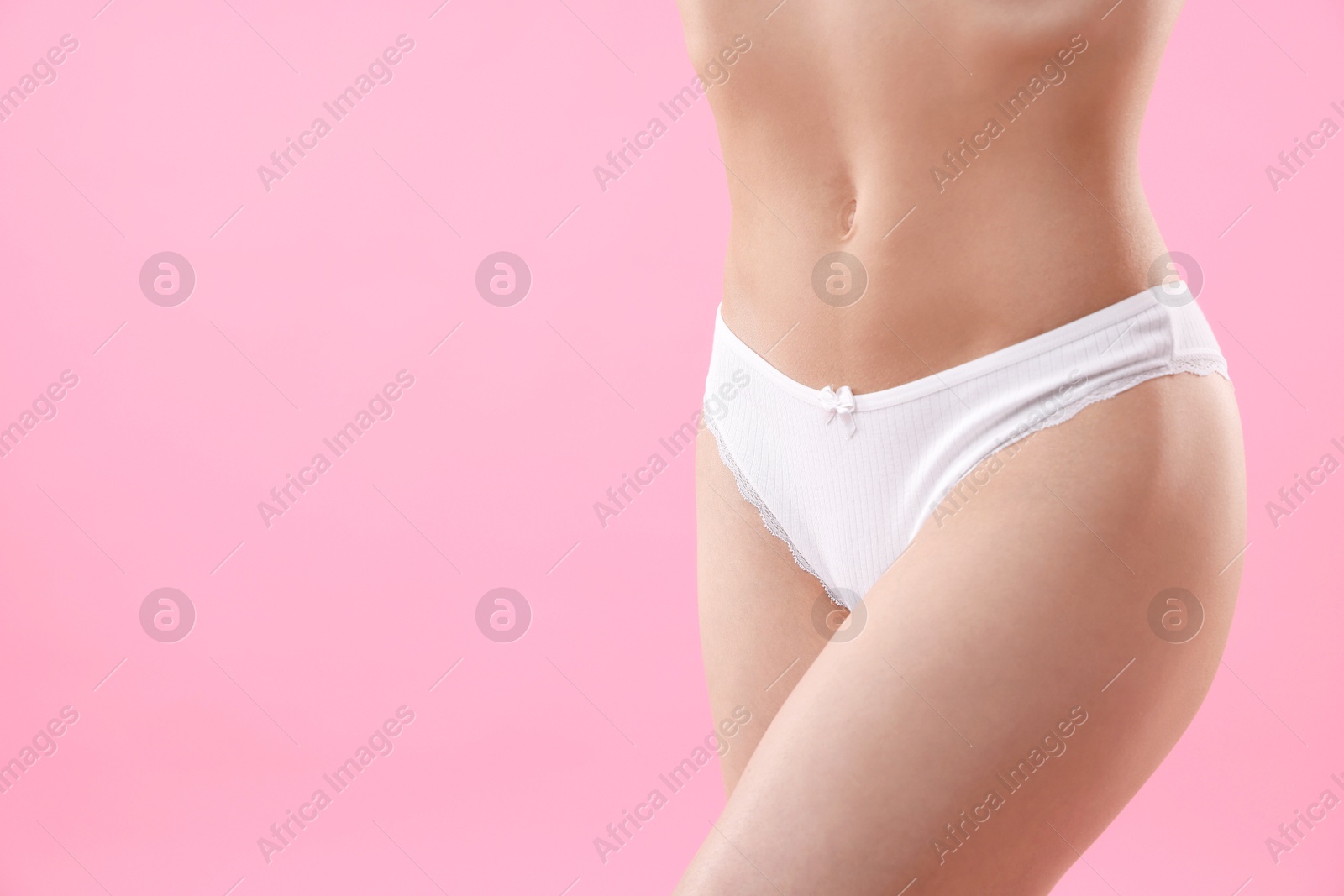 Woman wearing beautiful underwear on pink background, closeup. Space for text Photo of Woman wearing beautiful underwear on pink background, closeup. Space for text