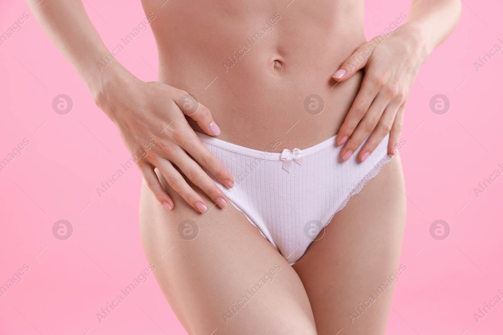 Woman wearing beautiful underwear on pink background, closeup Photo of Woman wearing beautiful underwear on pink background, closeup