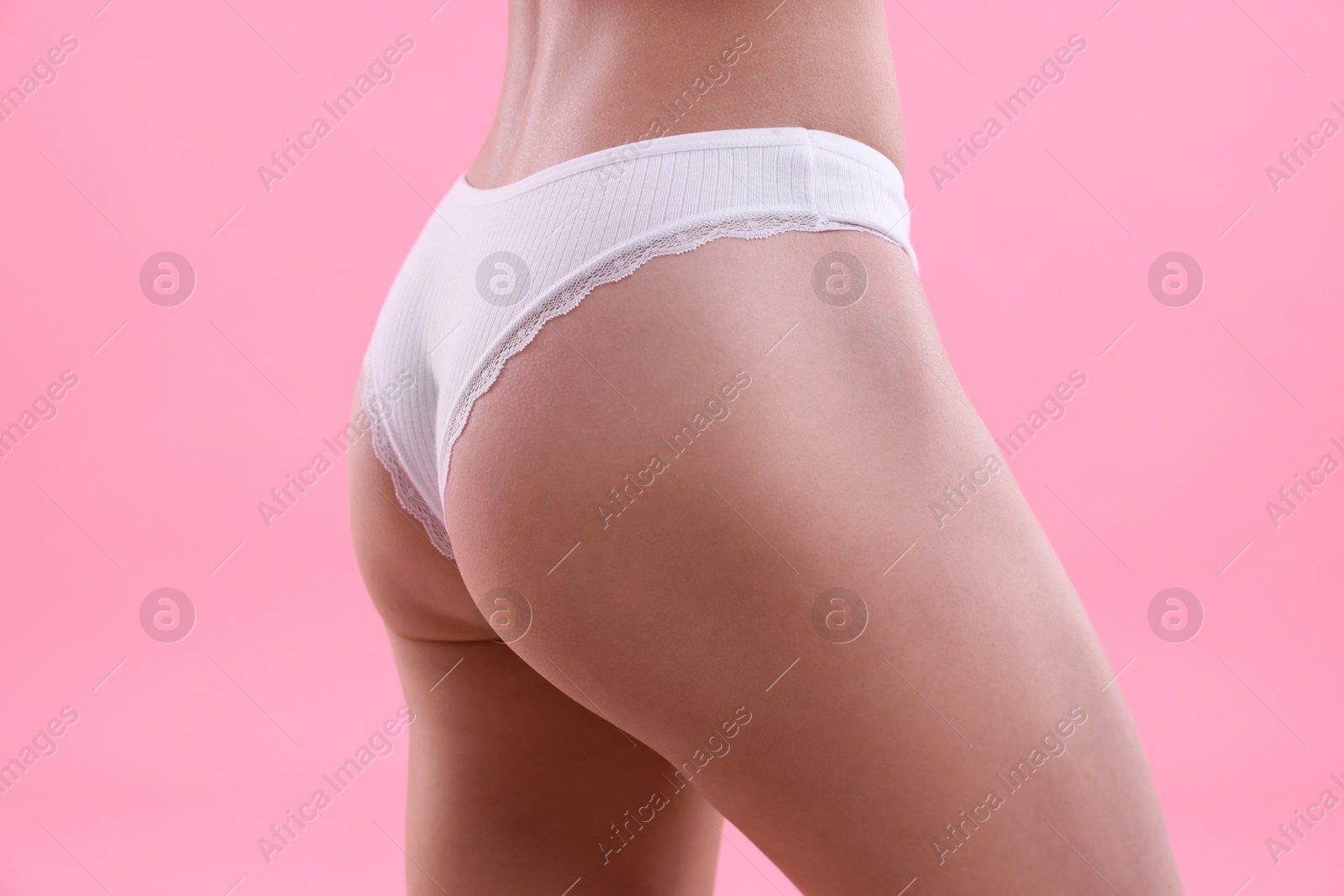 Woman wearing beautiful underwear on pink background, closeup Photo of Woman wearing beautiful underwear on pink background, closeup