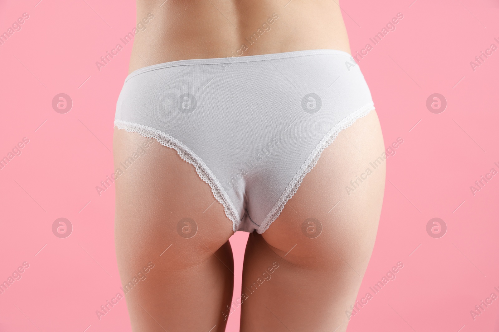 Woman wearing beautiful underwear on pink background, closeup Photo of Woman wearing beautiful underwear on pink background, closeup