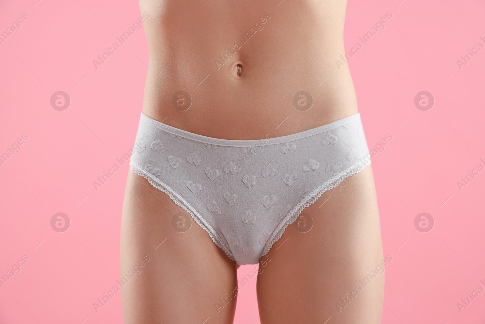 Woman wearing beautiful underwear on pink background, closeup Photo of Woman wearing beautiful underwear on pink background, closeup