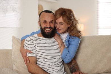 Photo of Portrait of happy mature couple at home