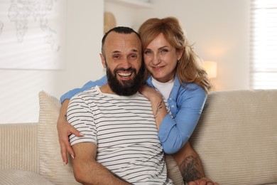 Photo of Portrait of happy mature couple at home