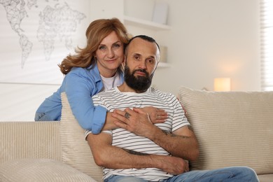 Photo of Portrait of lovely mature couple at home