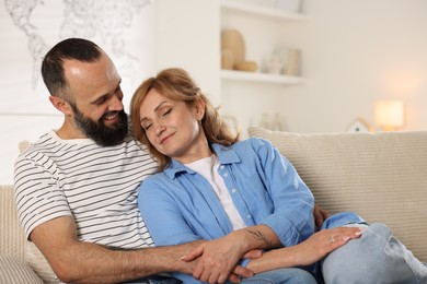 Photo of Portrait of lovely couple on sofa at home