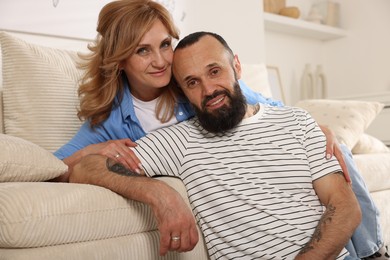 Photo of Portrait of happy mature couple at home