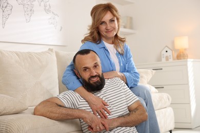 Photo of Portrait of happy mature couple at home