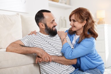 Photo of Portrait of happy mature couple at home