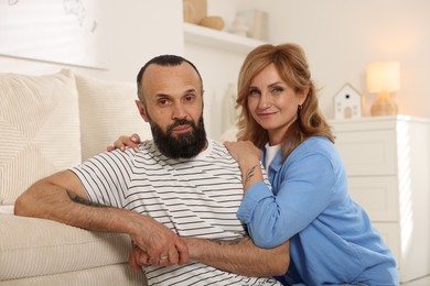 Photo of Portrait of lovely mature couple at home