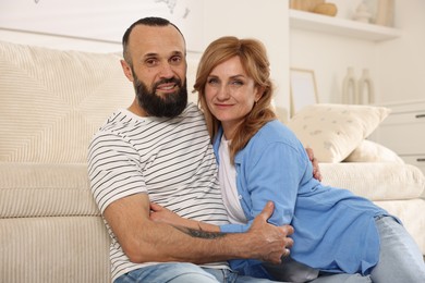 Photo of Portrait of happy mature couple at home