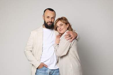 Photo of Portrait of lovely couple on light grey background