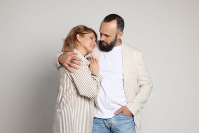 Photo of Portrait of lovely couple on light grey background