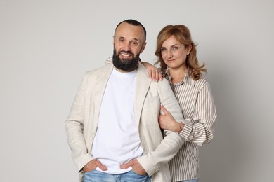 Photo of Portrait of lovely couple on light grey background