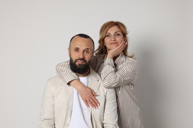 Photo of Portrait of lovely couple on light grey background