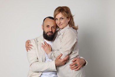 Photo of Portrait of lovely couple on light grey background