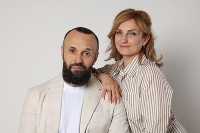 Photo of Portrait of lovely couple on light grey background