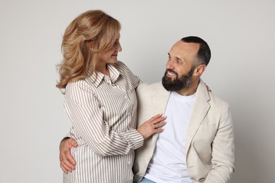 Photo of Portrait of lovely couple on light grey background