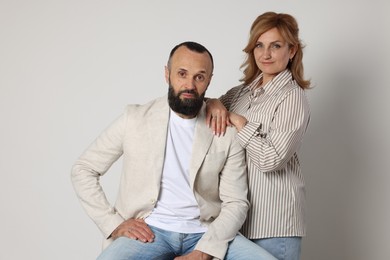 Photo of Portrait of lovely couple on light grey background