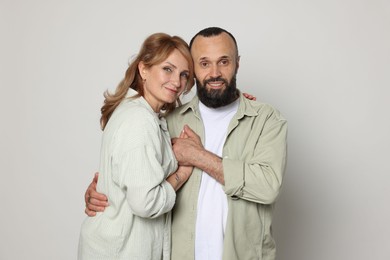 Photo of Portrait of lovely couple on light grey background