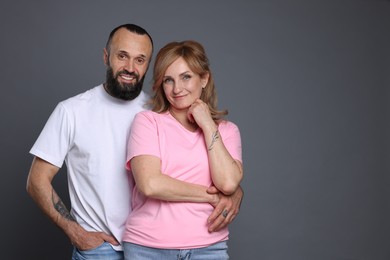 Photo of Portrait of lovely couple on grey background, space for text